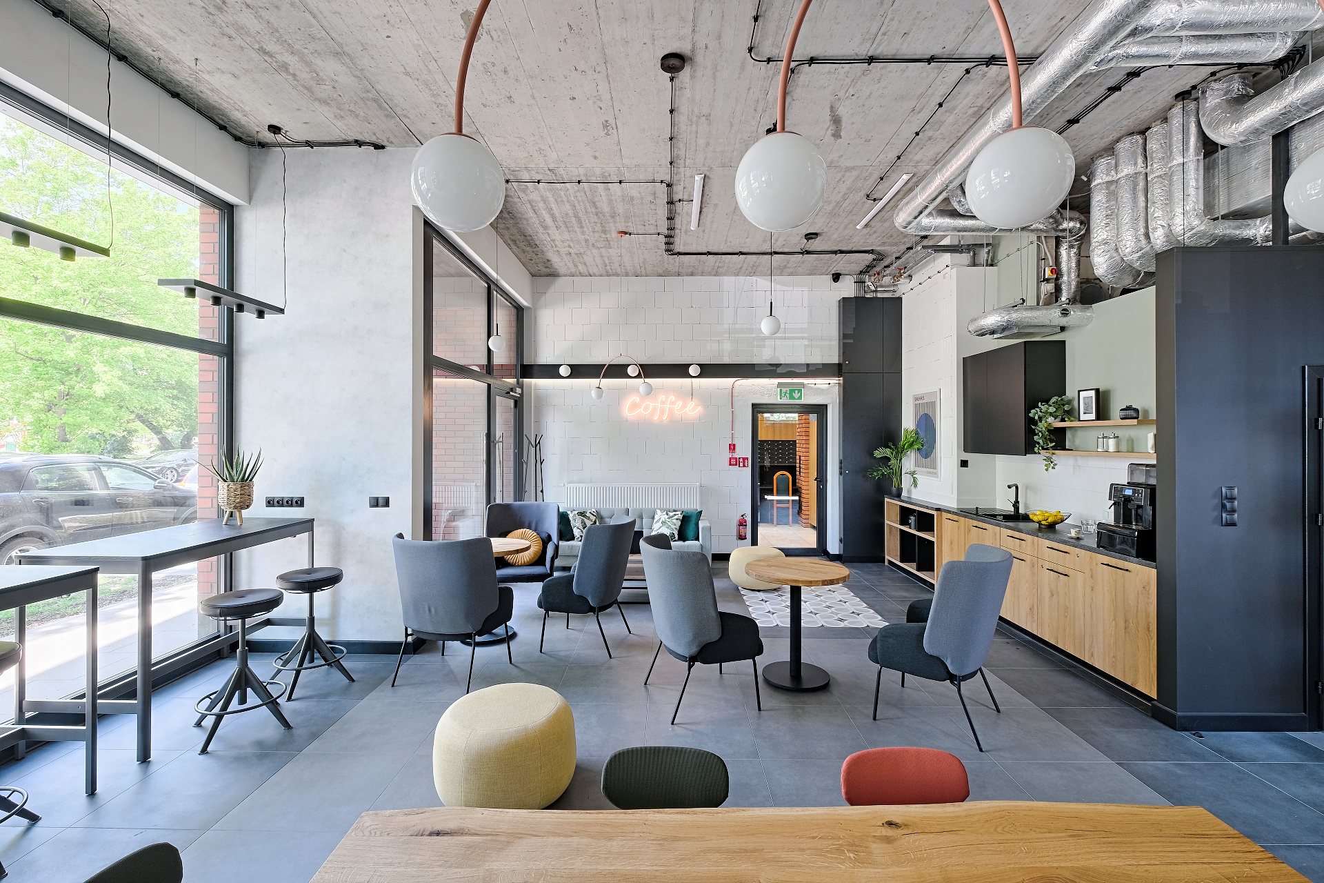 Lounge area in the Club Room with a Coffee neon sign